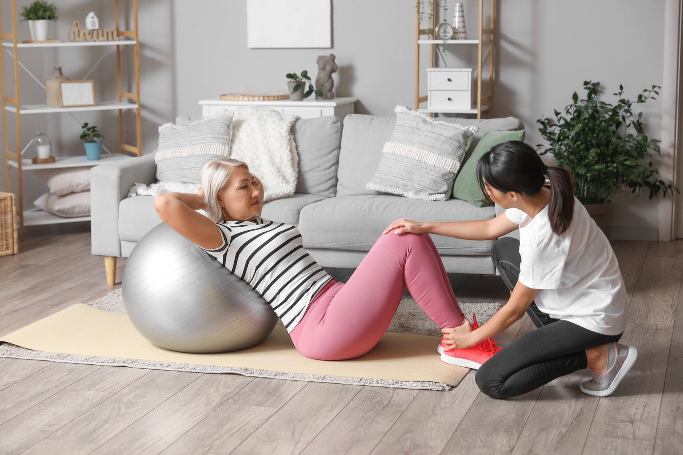 A Physiotherapy Delivered therapist during an in-home visit